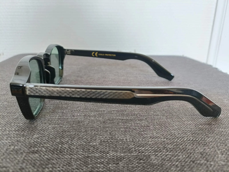 Black pantos glasses with green lenses