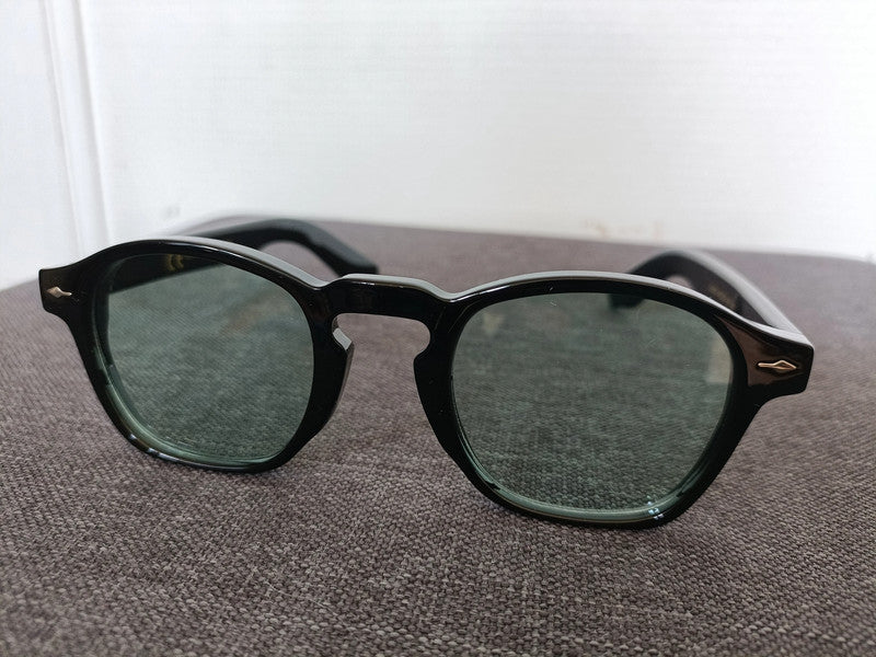 Black pantos glasses with green lenses