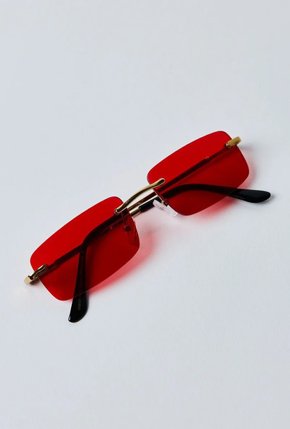 Lunettes de soleil rectangulaires à verres sans monture rouges
